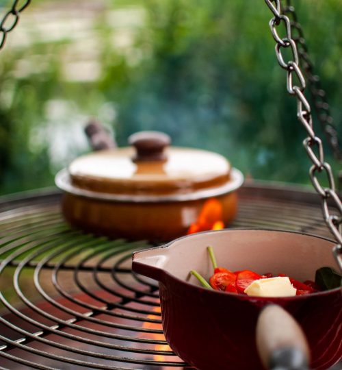 Firepit cooking outside the Shepherd's Huts